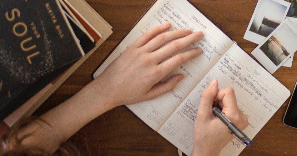 A woman making notes in a notebook