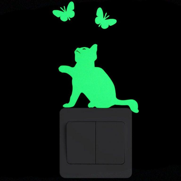 Photo of a luminous wall sticker depicting a cat and butterflies
